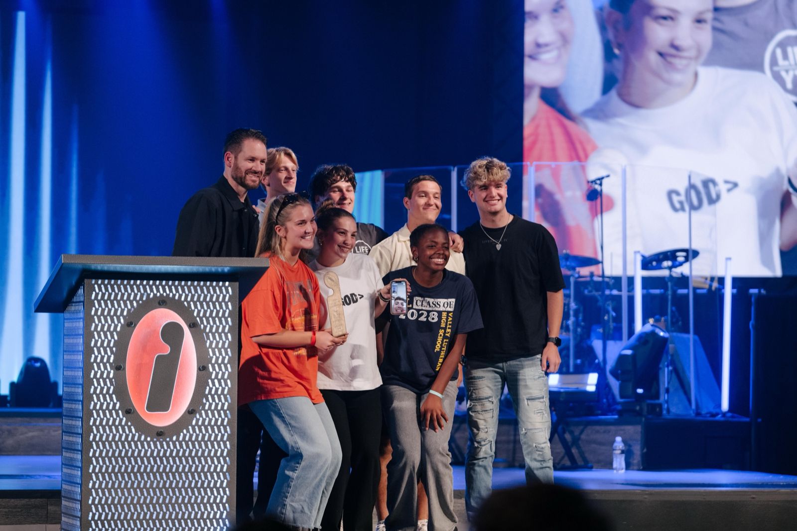 Students on stage after giving their lives to Jesus