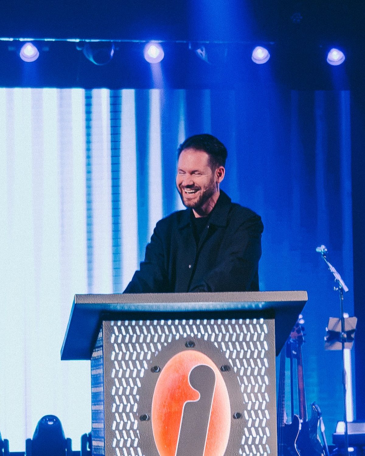 Josh laughing at the Invasion pulpit