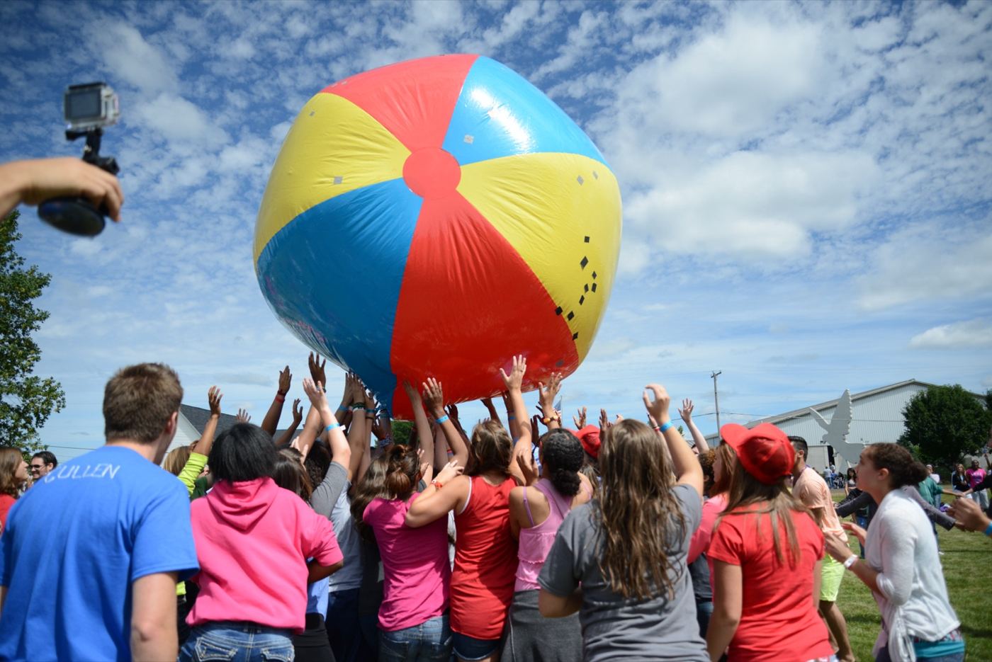 Students under a giant beach ball