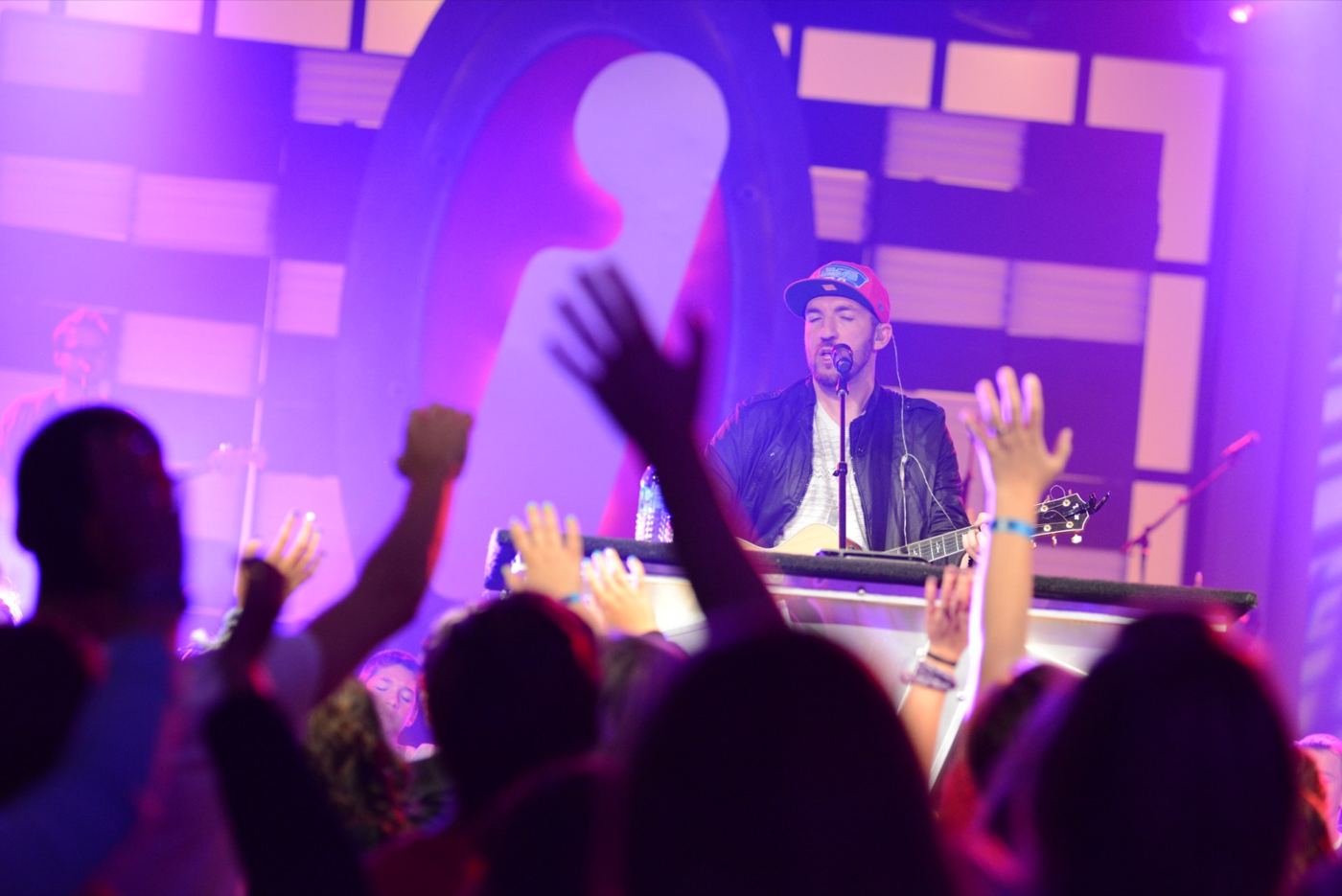 A worship leader with guitar